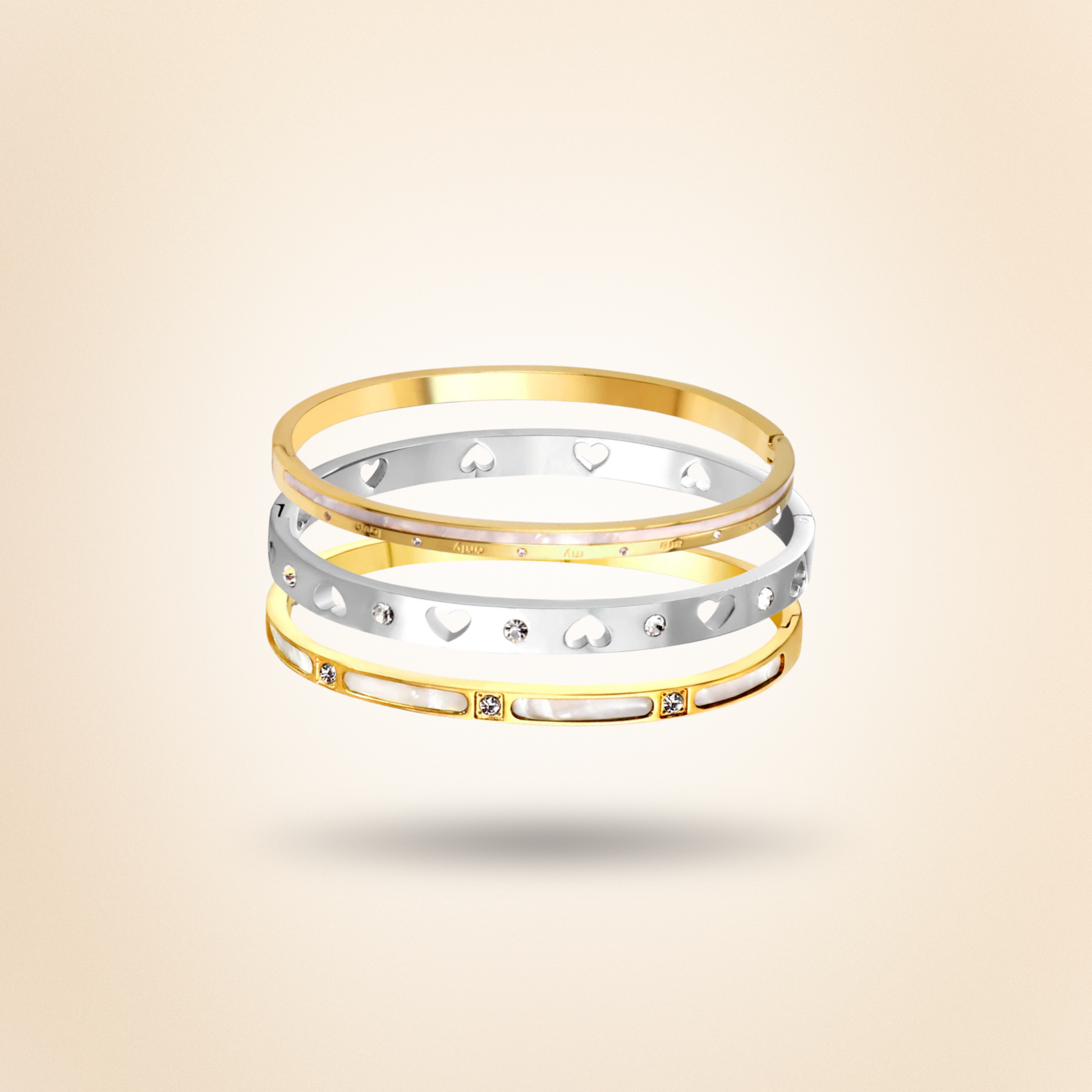 Two gold and one silver bracelet with heart designs on a beige background