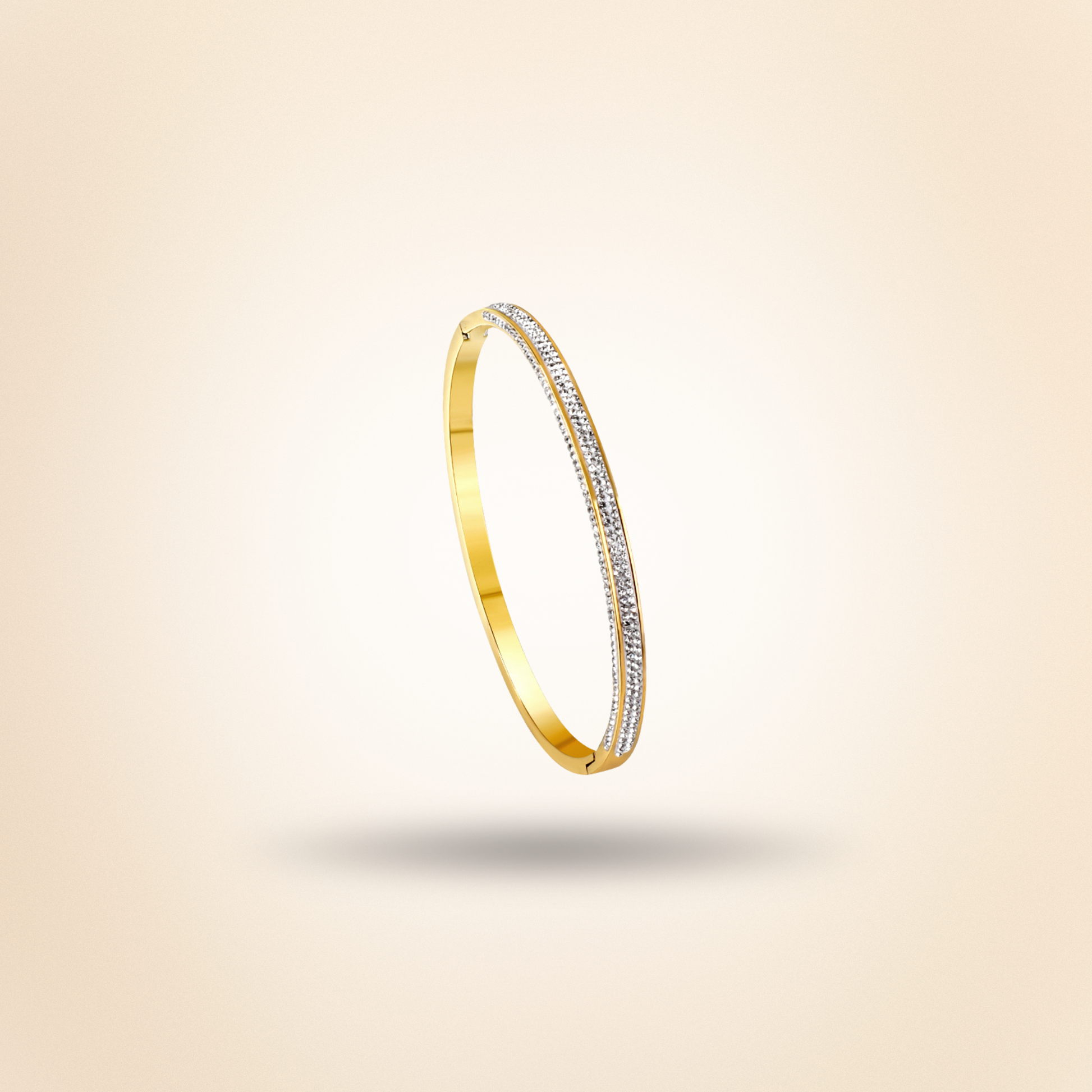 Gold bracelet with diamond accents on a beige background