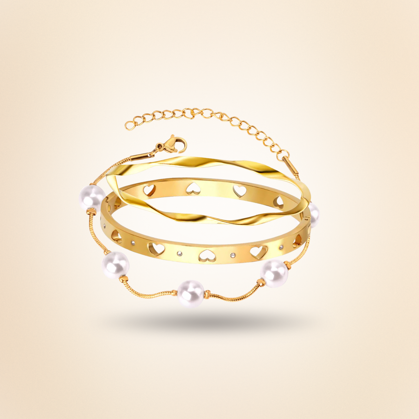 Gold bracelet with pearls on a beige background