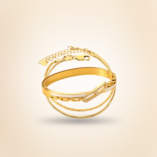 Gold bracelet on a beige background